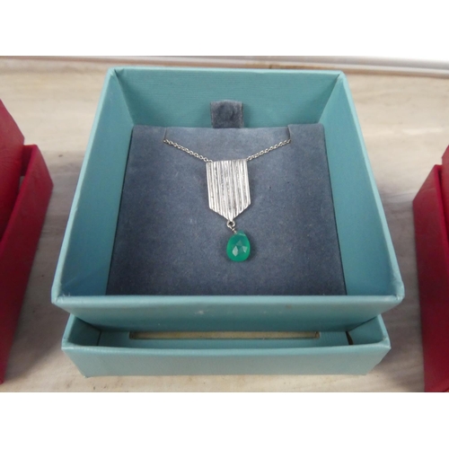 249 - Three necklaces in presentation boxes.