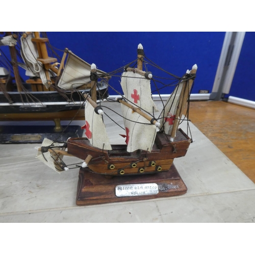 259 - A Cuttysark model boat and two others.  Tallest approx 30cm.