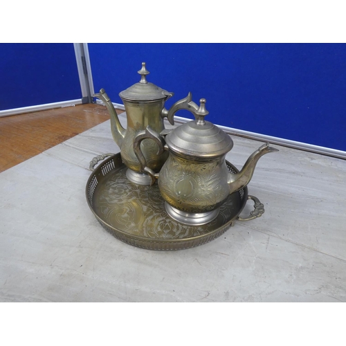 263 - A pair of silver plated coffee and teapots on a serving tray.