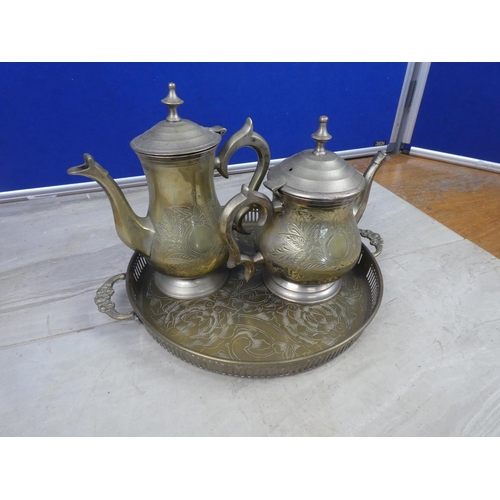 263 - A pair of silver plated coffee and teapots on a serving tray.