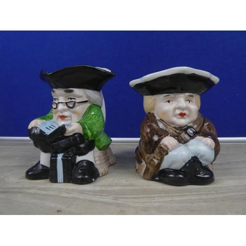 275 - Two ornamental toby jugs.