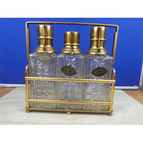 291 - A vintage triple decanter tantalus.