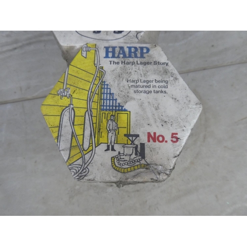 294 - An unopened pack of Harp Larger coasters.