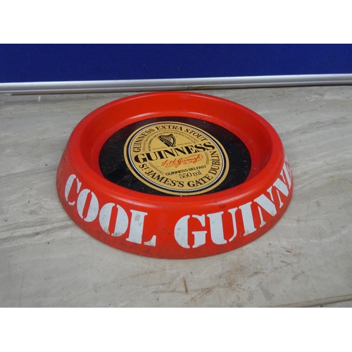 297 - A vintage Guinness metal ashtray.