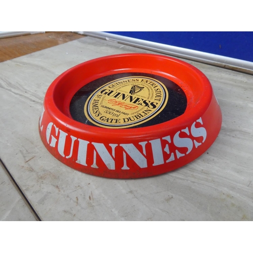 297 - A vintage Guinness metal ashtray.