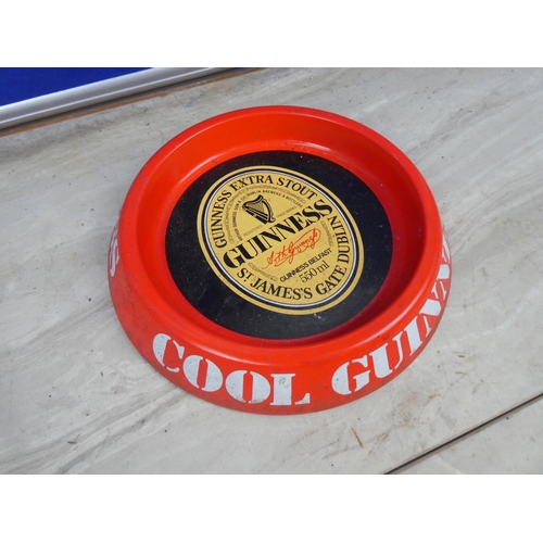 297 - A vintage Guinness metal ashtray.