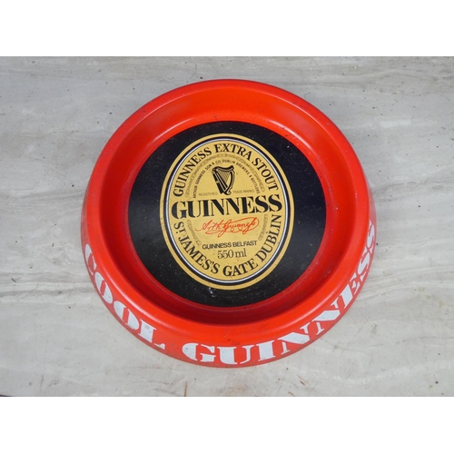 297 - A vintage Guinness metal ashtray.