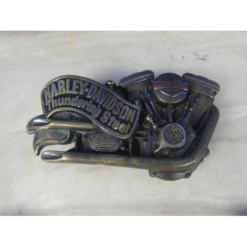 333 - Three Harley Davidson belt buckles and two others.