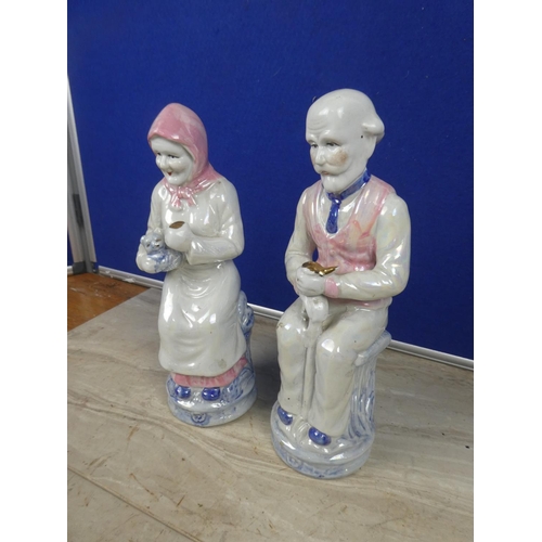 363 - A pair of large ceramic granny & granda figures.  Approx 28cm.