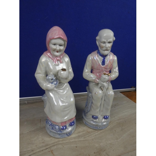 363 - A pair of large ceramic granny & granda figures.  Approx 28cm.