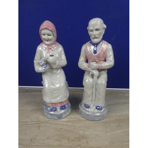 363 - A pair of large ceramic granny & granda figures.  Approx 28cm.