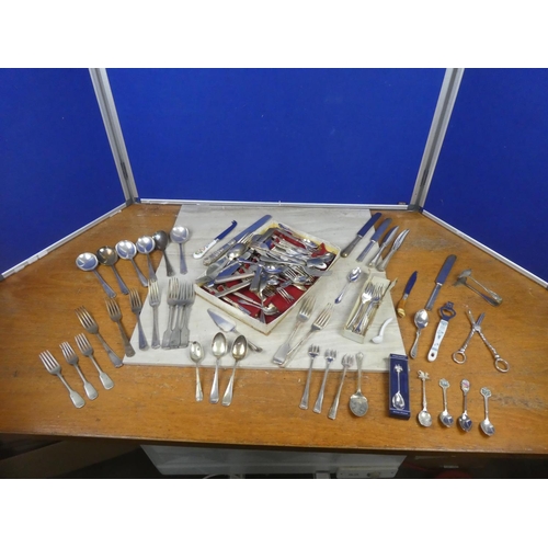 399 - An assortment of antique and vintage plated cutlery and more.