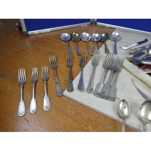 399 - An assortment of antique and vintage plated cutlery and more.