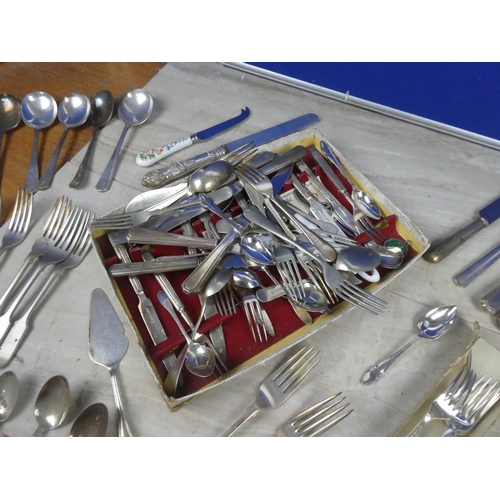 399 - An assortment of antique and vintage plated cutlery and more.