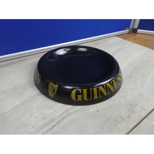 304 - A metal Guinness ashtray.