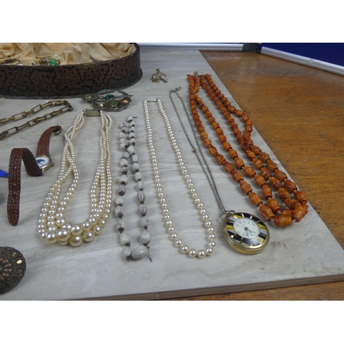 308 - A vintage jewellery case and a lot of assorted vintage necklaces, brooches and lots more.