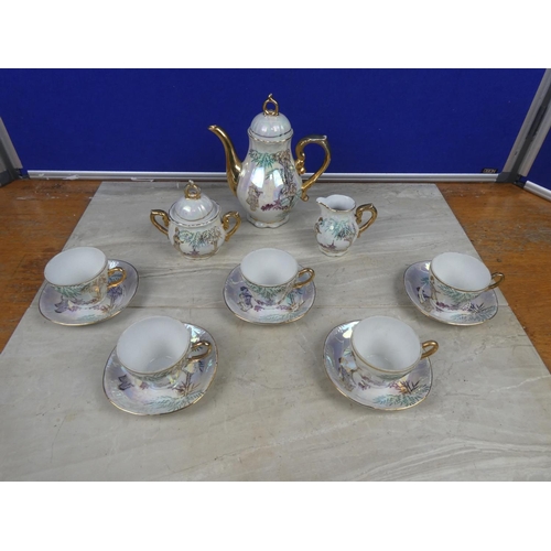 313 - A stunning Japanese coffee set with gilt detail.