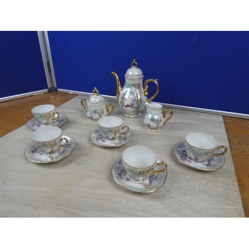 313 - A stunning Japanese coffee set with gilt detail.