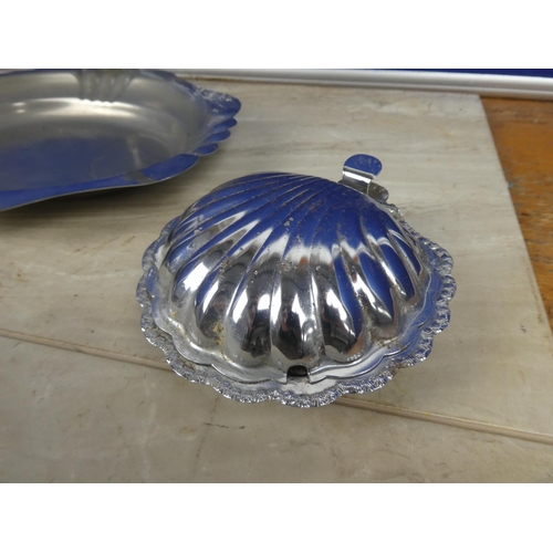 314 - A vintage silver plated swing handle serving dish and two shell shaped silver plate and glass butter... 