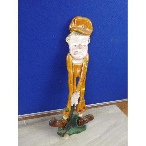 316 - A stunning ceramic figure of a golfer by Licinio, Portugal.