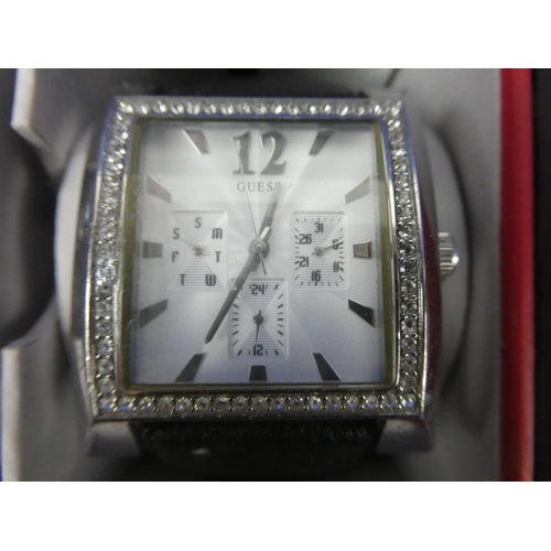 321 - A stunning cased Guess multifunctional ladies wrist watch.