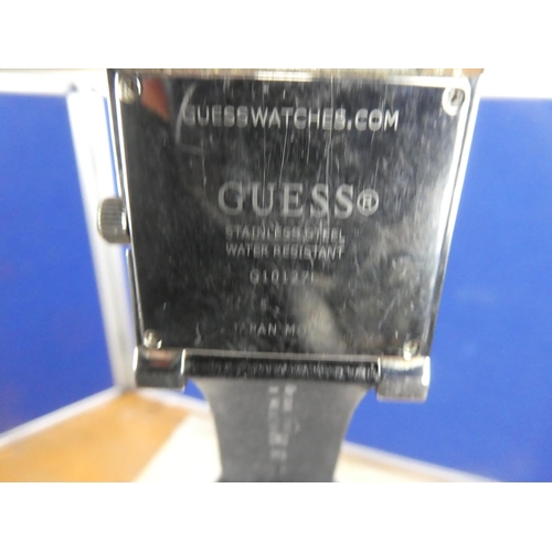 321 - A stunning cased Guess multifunctional ladies wrist watch.