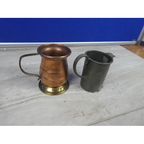 322 - An antique Sheffield hand hammered pewter jug and another copper and brass jug,