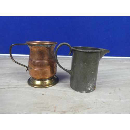 322 - An antique Sheffield hand hammered pewter jug and another copper and brass jug,