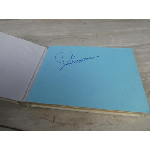 327 - A vintage autograph books containing various signatures.