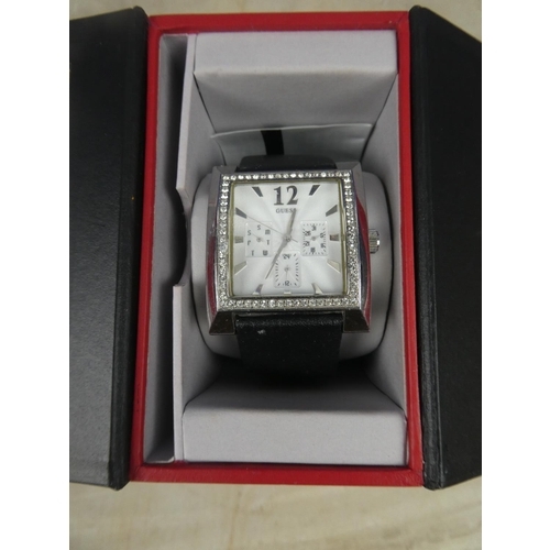 321 - A stunning cased Guess multifunctional ladies wrist watch.