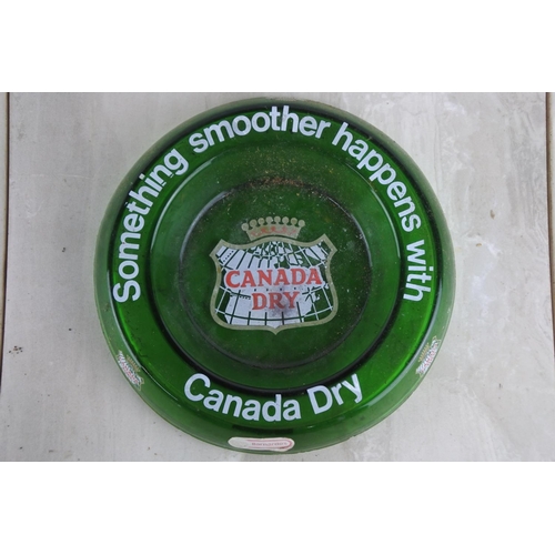 109 - A vintage Canada Dry green glass ashtray.