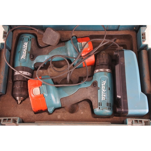 124 - A cased Makita drill set.