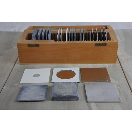 127 - A wooden cased set of various slides