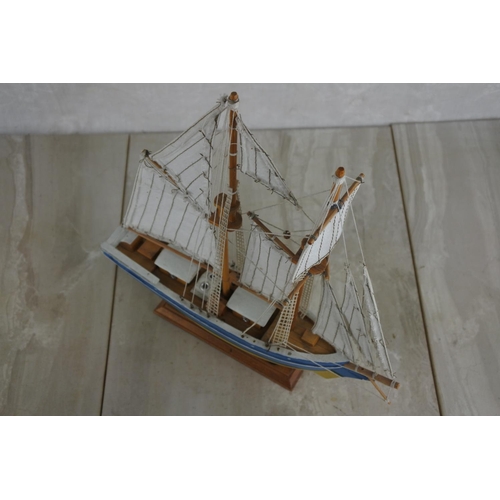 128 - A model ship.  Approx 30cm.