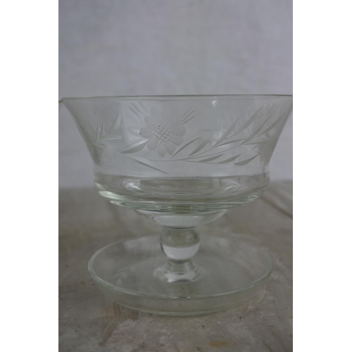 130 - A set of four etched glass sundae dishes.