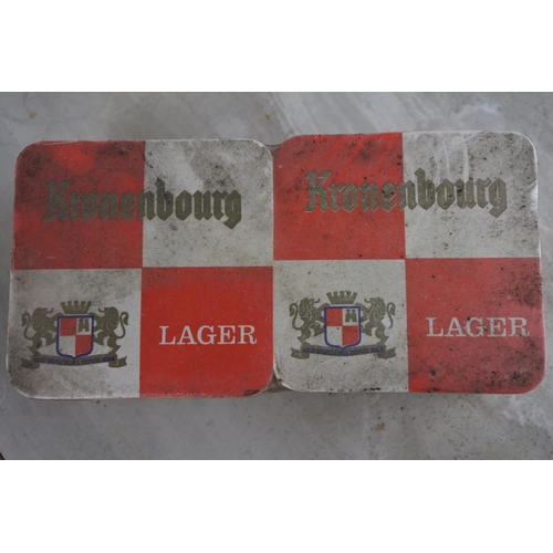 133 - An unopened pack of Kronenbourg Larger beer mats.