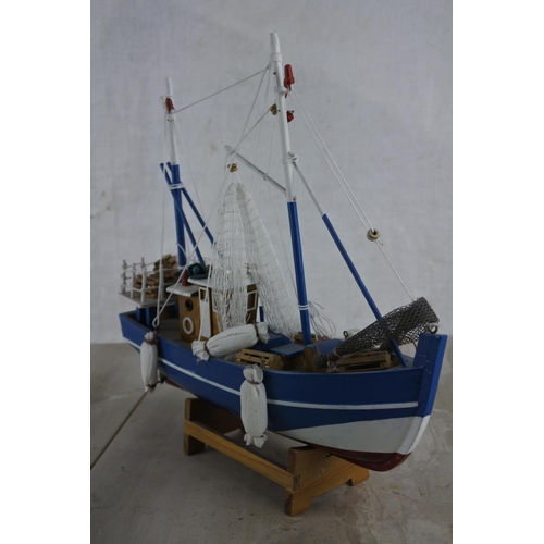 135 - A model fishing boat.  Approx 30cm.