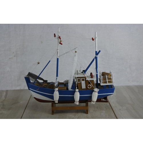 135 - A model fishing boat.  Approx 30cm.