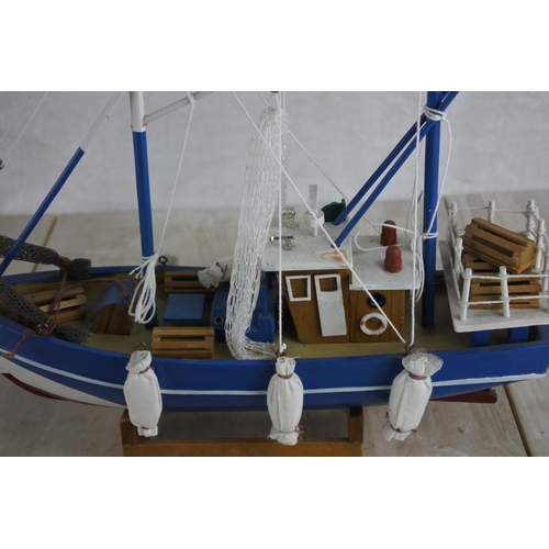 135 - A model fishing boat.  Approx 30cm.