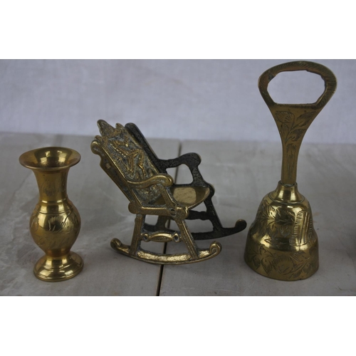 136 - A large collection of small brass ware items to include a rocking chair, a harp and more.