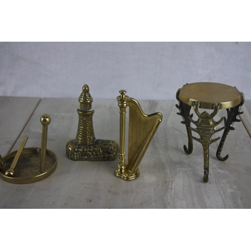 136 - A large collection of small brass ware items to include a rocking chair, a harp and more.