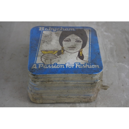 141 - A pack of unopened Babycham - A Passion for Fashion beer mats.