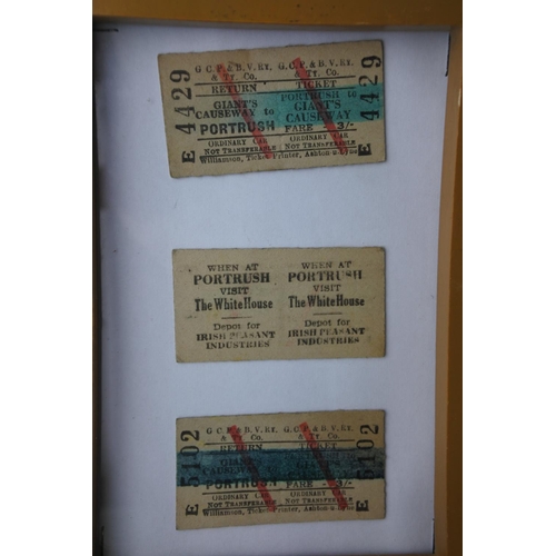 145 - A framed set of three Portrush - Giant's Causeway tram tickets.  Approx 16x21cm.