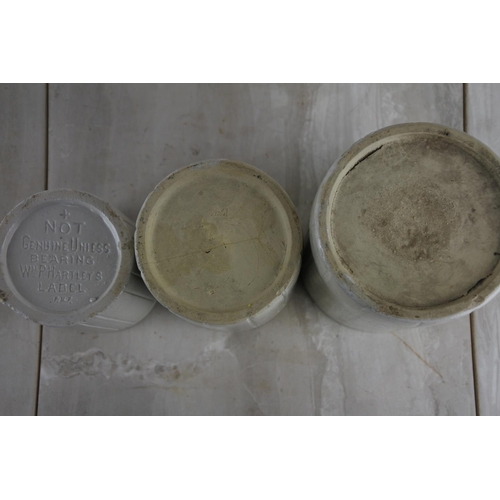 146 - A trio of antique stoneware containers.