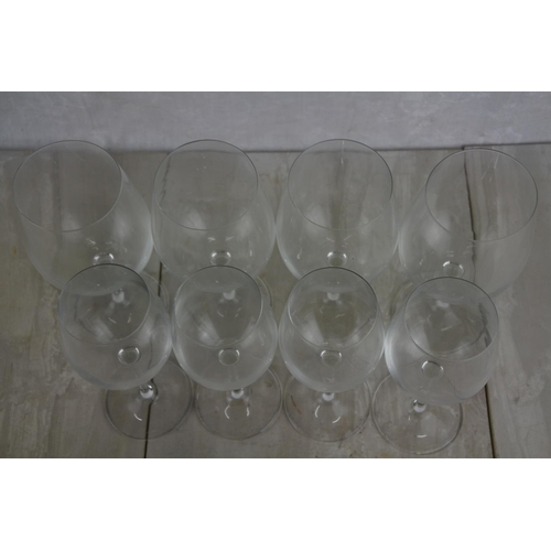 153 - Two sets of four Dartington wine glasses.