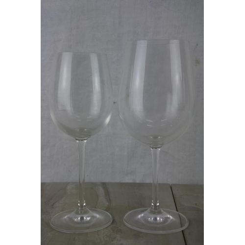 153 - Two sets of four Dartington wine glasses.