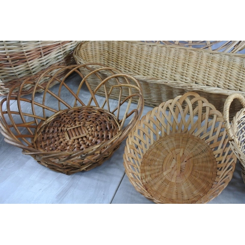 156 - A large lot of wicker and rattan baskets and trays and more.