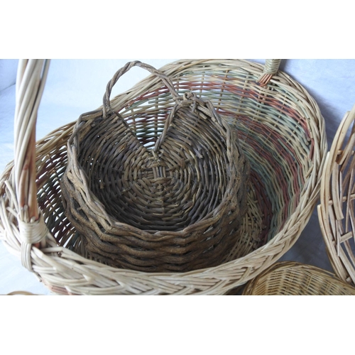 156 - A large lot of wicker and rattan baskets and trays and more.