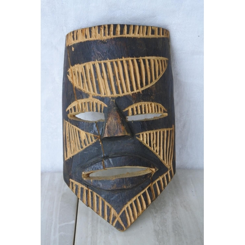 162 - A collection of various tribal masks, spear and more.