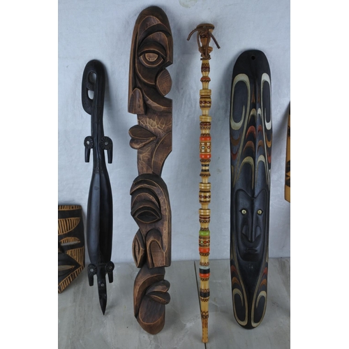 162 - A collection of various tribal masks, spear and more.